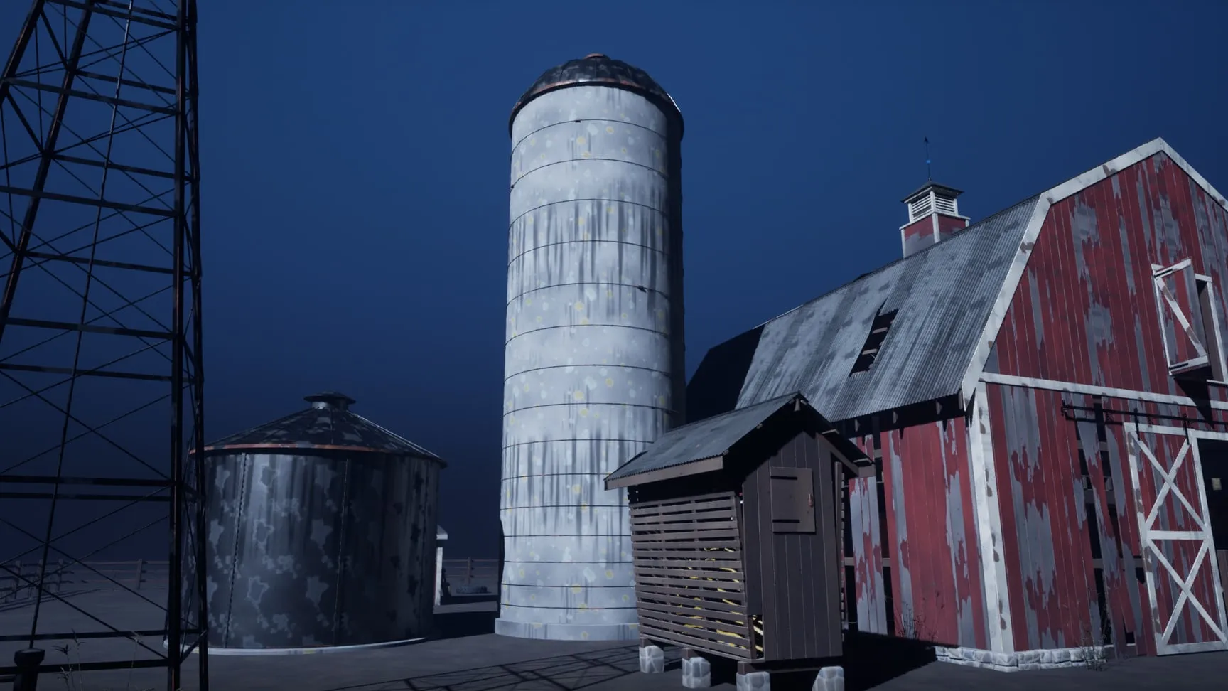 Silo, grain bin and windmill on the moonlit side of the barn