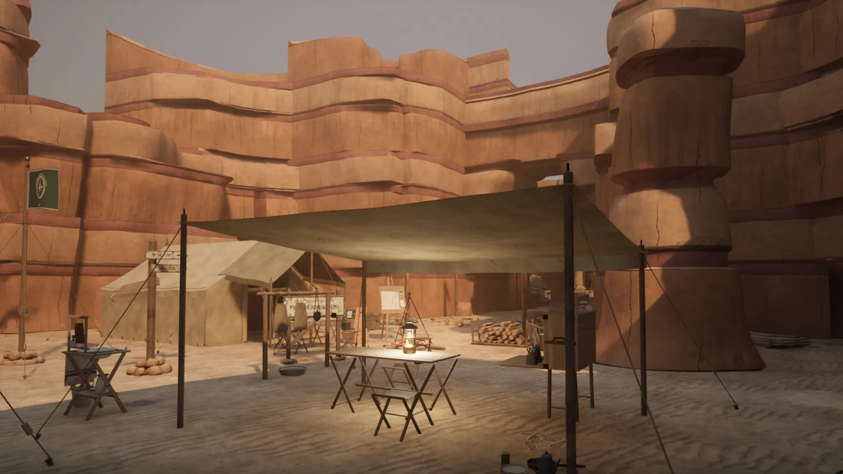 The camp under the overhang: the cook-fly, the wall tent, the camp table